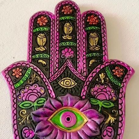 Decorative Hamsa hand with colorful patterns on a white background