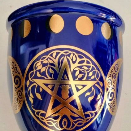 Blue smudge stick container with gold pentagram design on a white background