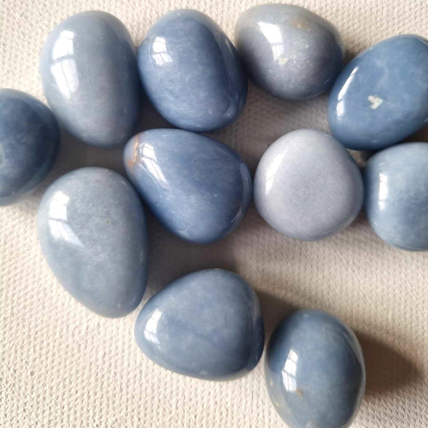 Blue stones on a textured beige surface