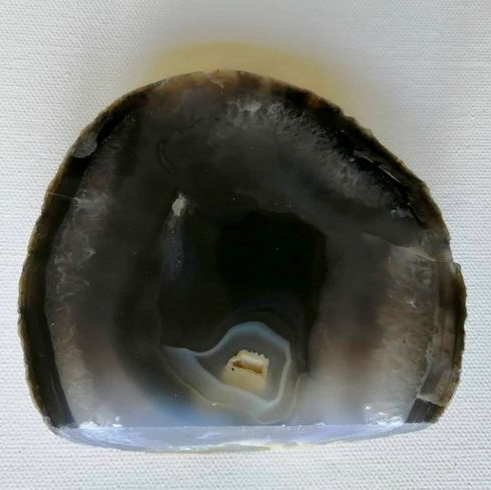 Close-up of a polished agate stone on a white background