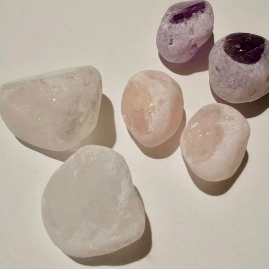 Set of six crystal stones on a light background