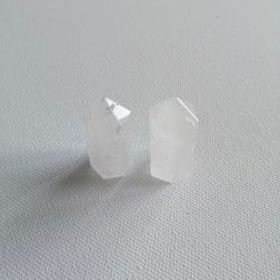 Two clear crystal small points on a light gray background