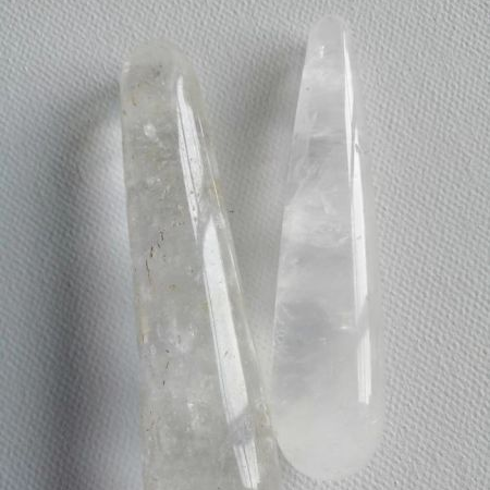 Clear crystal wands on a gray background