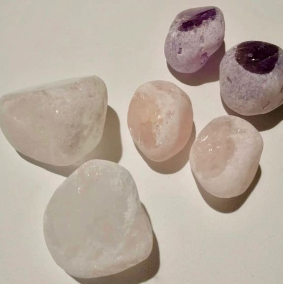 Set of six crystal stones on a light background