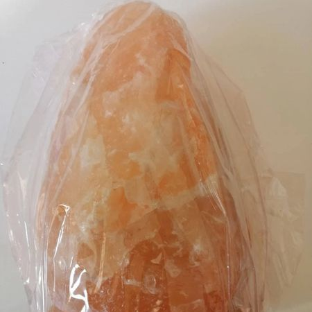 Himalaya salt lamp on a white background