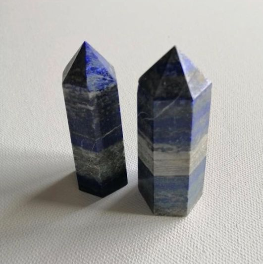 Two lapis points on a white background