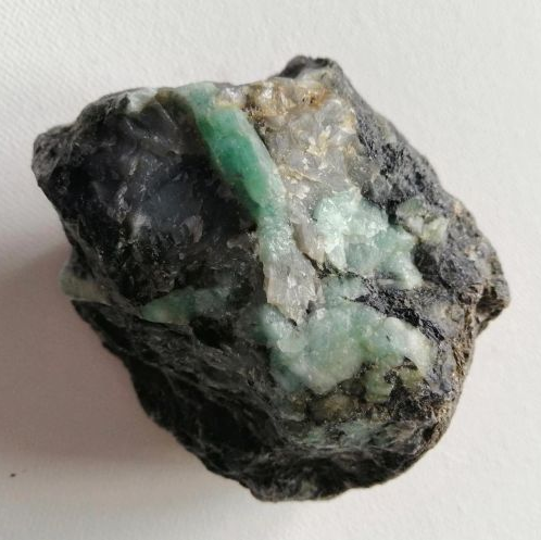 Raw Emerald on a white background