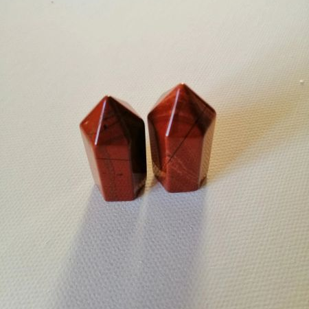 Two mini points on a textured white surface
