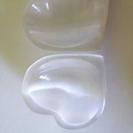 Heart-shaped Selenite bowls on a light background