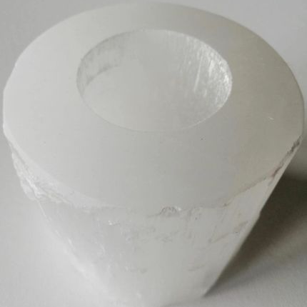 Selenite tealight candle holder on a white background