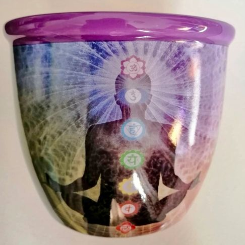 Smudge stick holder with chakra design on a white background