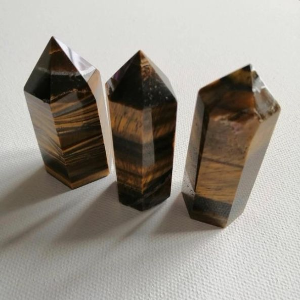 Three crystal points on a white background
