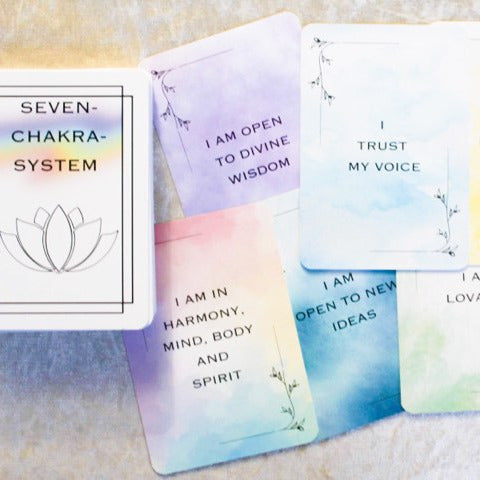 Set of affirmation cards with motivational phrases on a soft surface